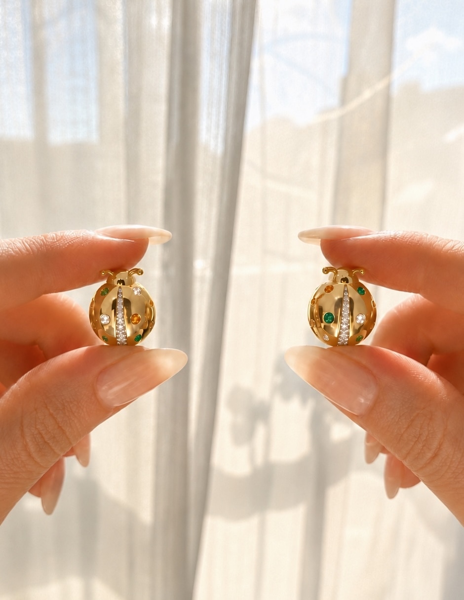 Broqueles de catarina nubia con acabado baño de oro zirconia 6
